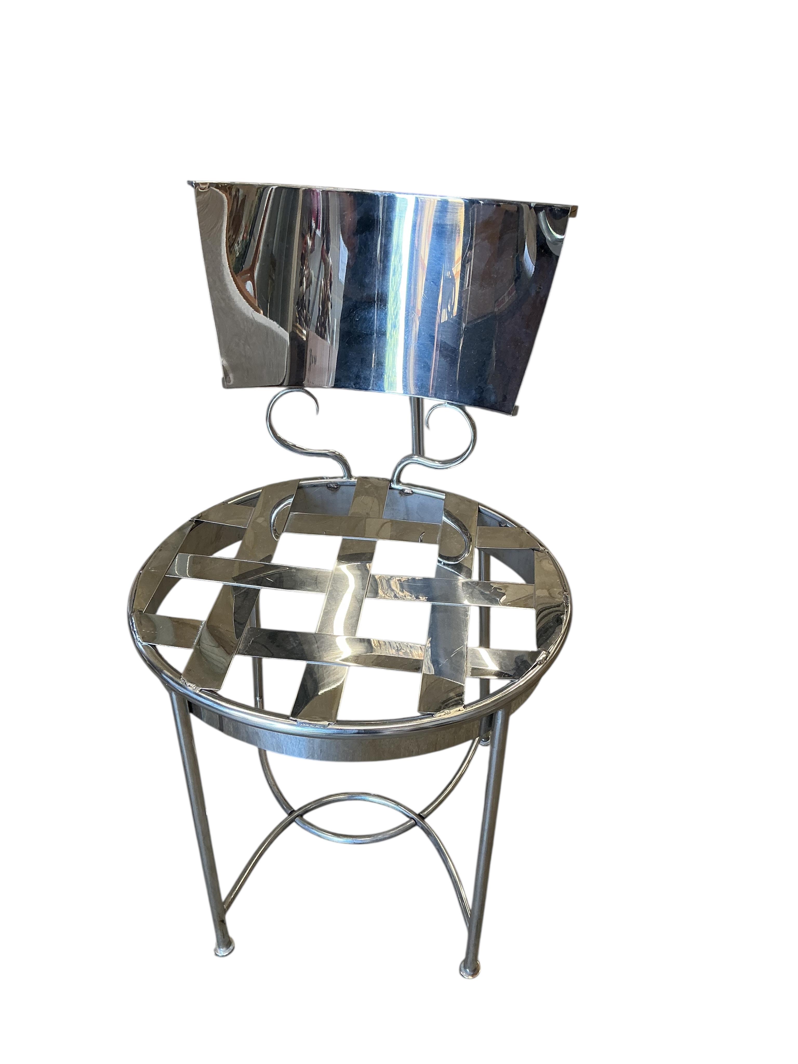 A pair of contemporary chrome chairs, height 80cm